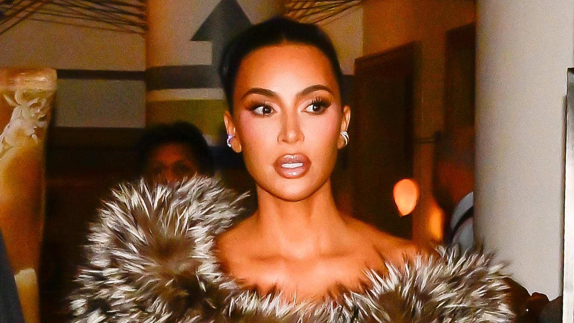 Kim Kardashian heats up ‘Kimsmas’ in a curve-hugging, cleavage-baring dress