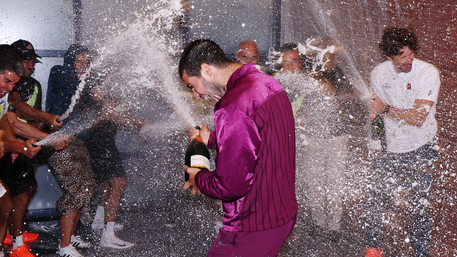 Carlos Alcaraz celebrates U.S. Open victory with tears, hugs, and a champagne shower