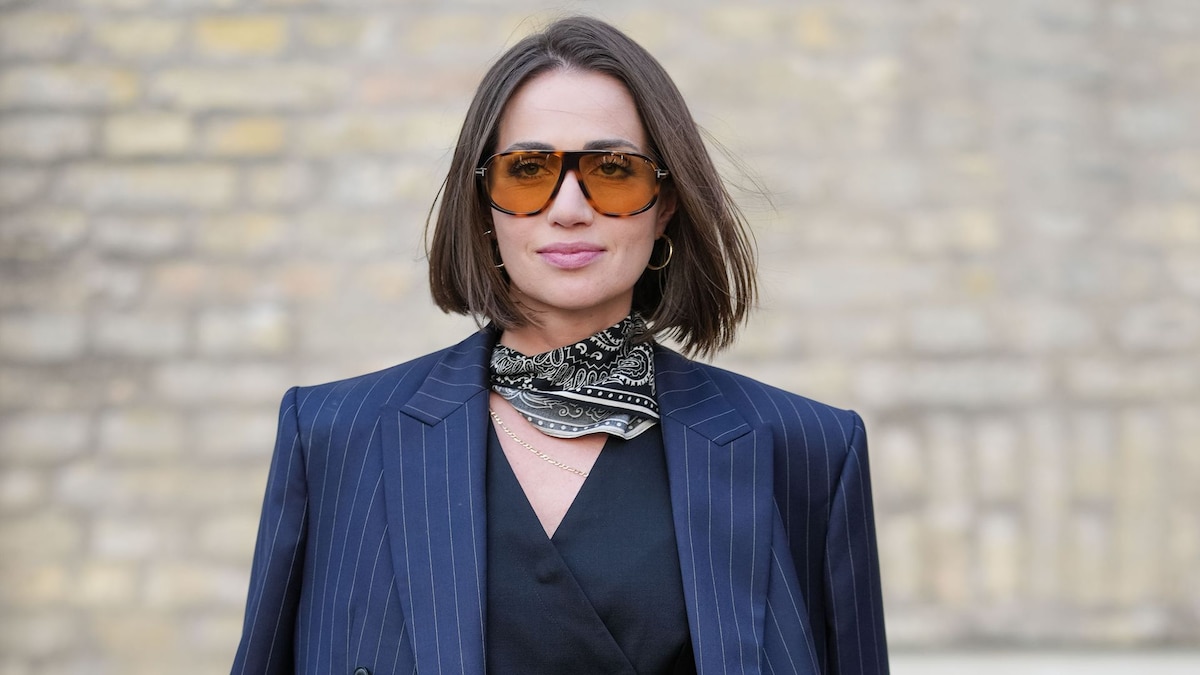 https://www.hola.com/us/horizon/landscape/a137b7fb994b-copenhagen-denmark-a-guest-wears-a-navy-pinstripe-blazer-draped-over-the-shoulde.jpg?im=Resize=(1200)