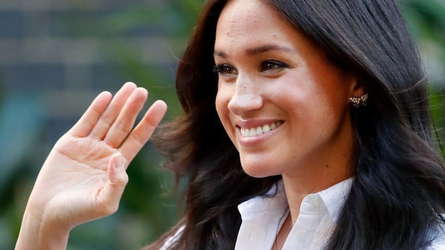 Meghan Markle wearing white blouse