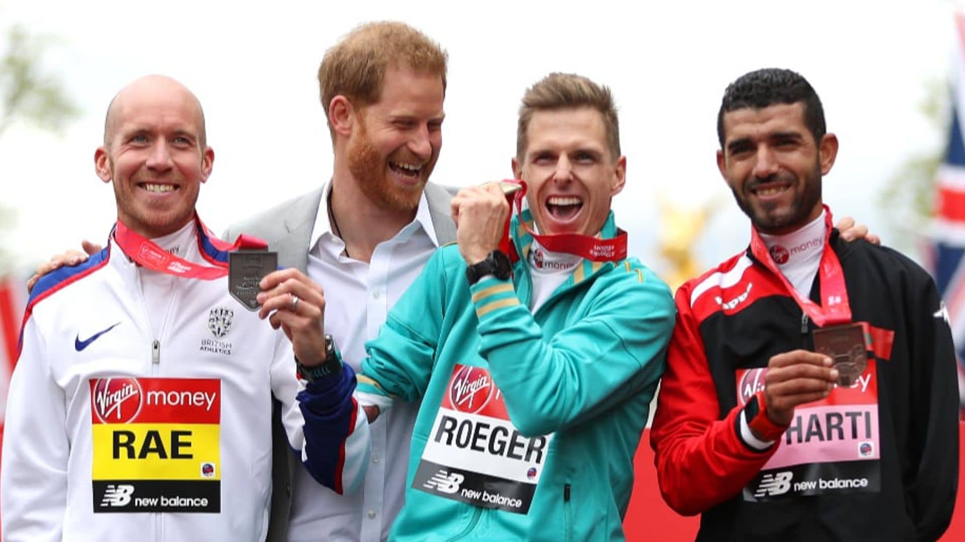 Prince Harry is all smiles at London Marathon as royal fans wait for Baby Sussex