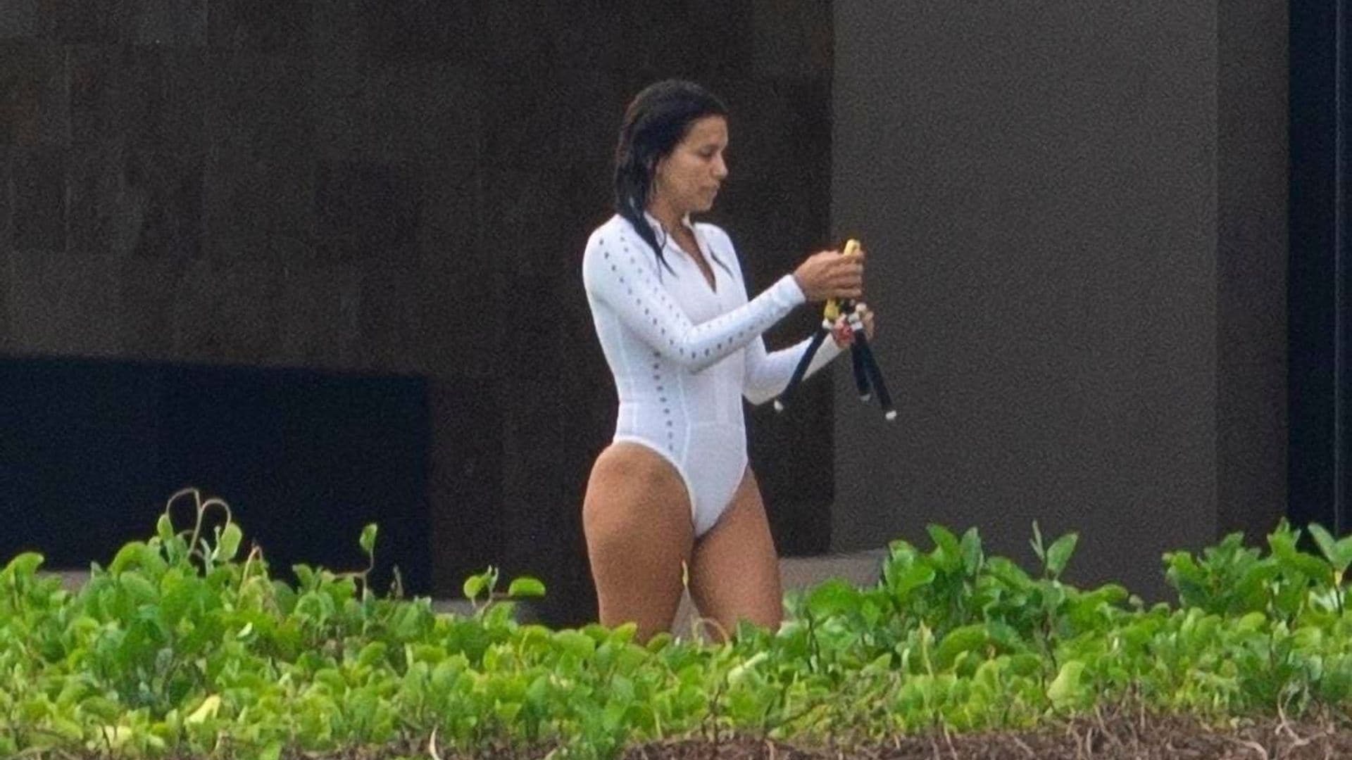 Eva Longoria gets cheeky in a sexy white one-piece bathing suit while in Cabo San Lucas