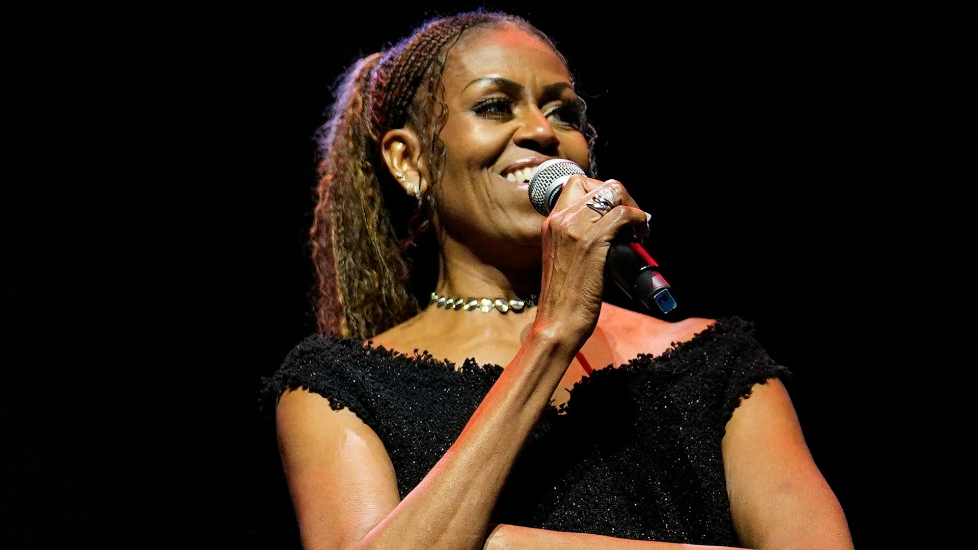 Michelle Obama embraces bold style in sleeveless fringe gown with thigh-high slit