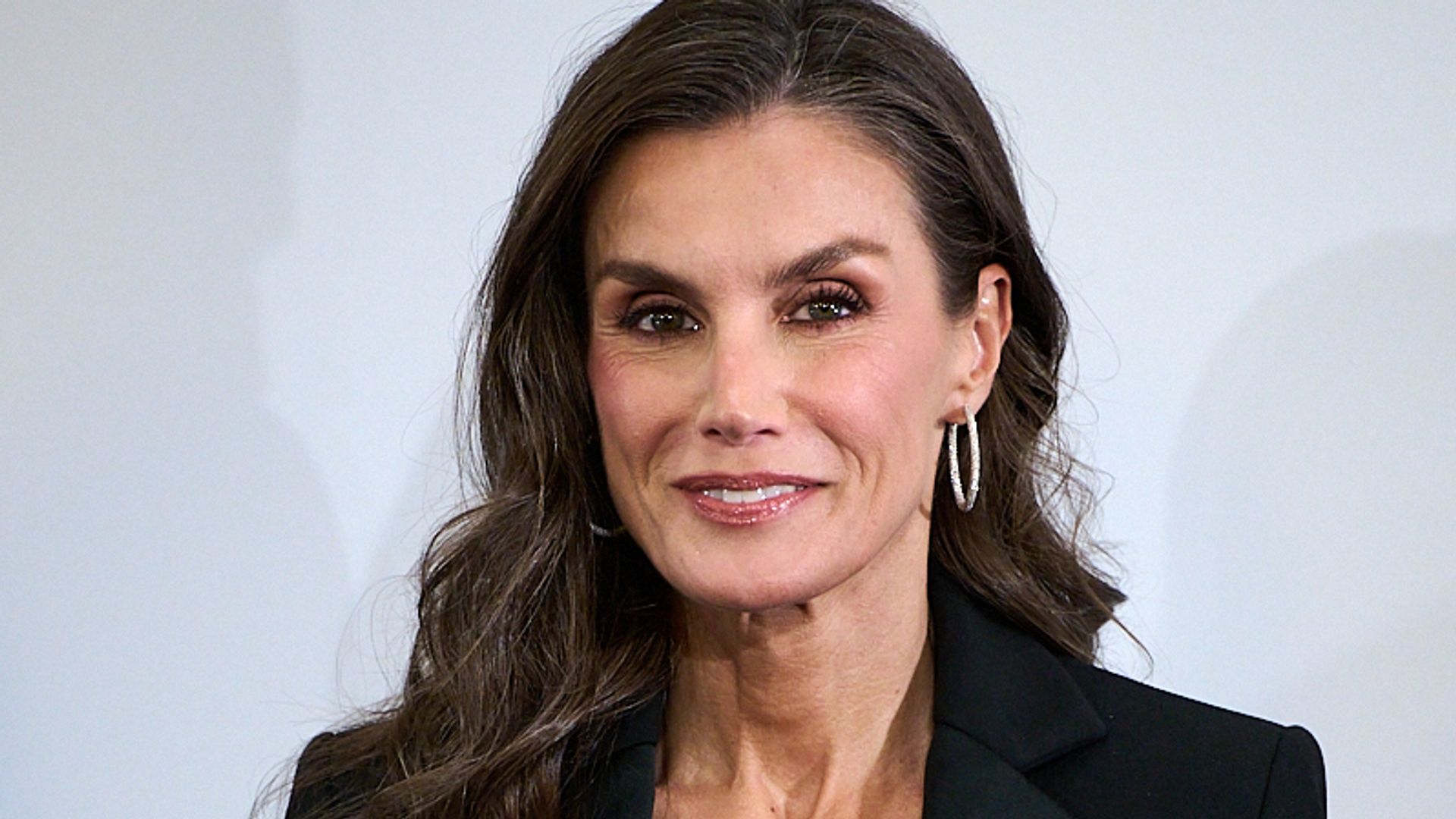 Queen Letizia turns heads in a glamorous black suit with a playful finish