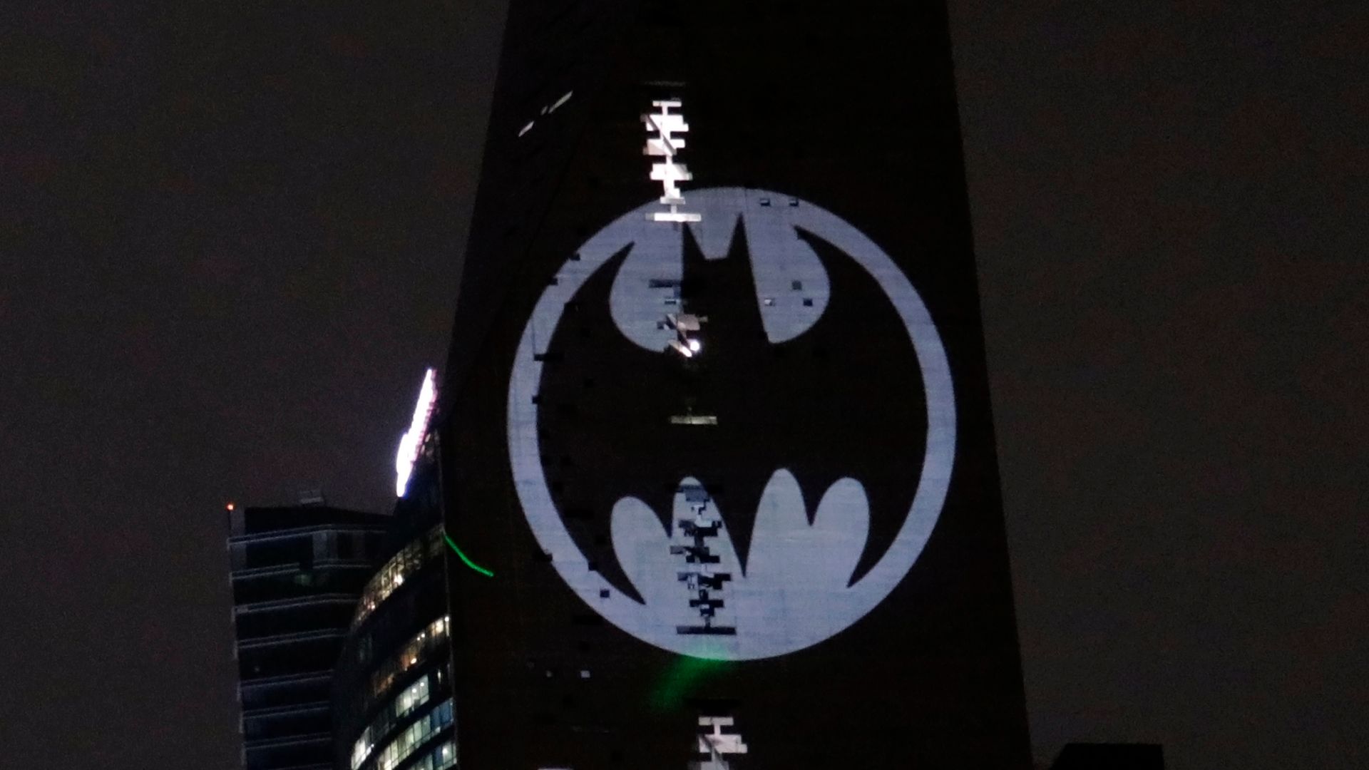 Hundreds of followers of the Dark Knight 'Batman' gathered at the Torre Reforma to appreciate the lighting of the batiseignal, the symbol that is projected in cities around the world to celebrate the 80th anniversary of the Dark Knight, on September 21, 2019 in Mexico City, Mexico (Photo by Eyepix/NurPhoto via Getty Images)