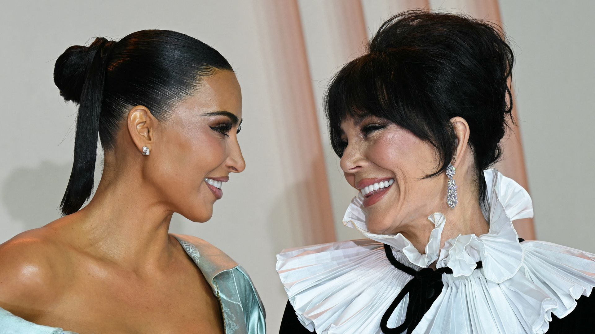 US reality TV personality Kim Kardashian and mother Kris Jenner pose during a photocall for the premiere of "All's Fair" TV series in Paris on October 21, 2025. (Photo by Bertrand GUAY / AFP) (Photo by BERTRAND GUAY/AFP via Getty Images)          