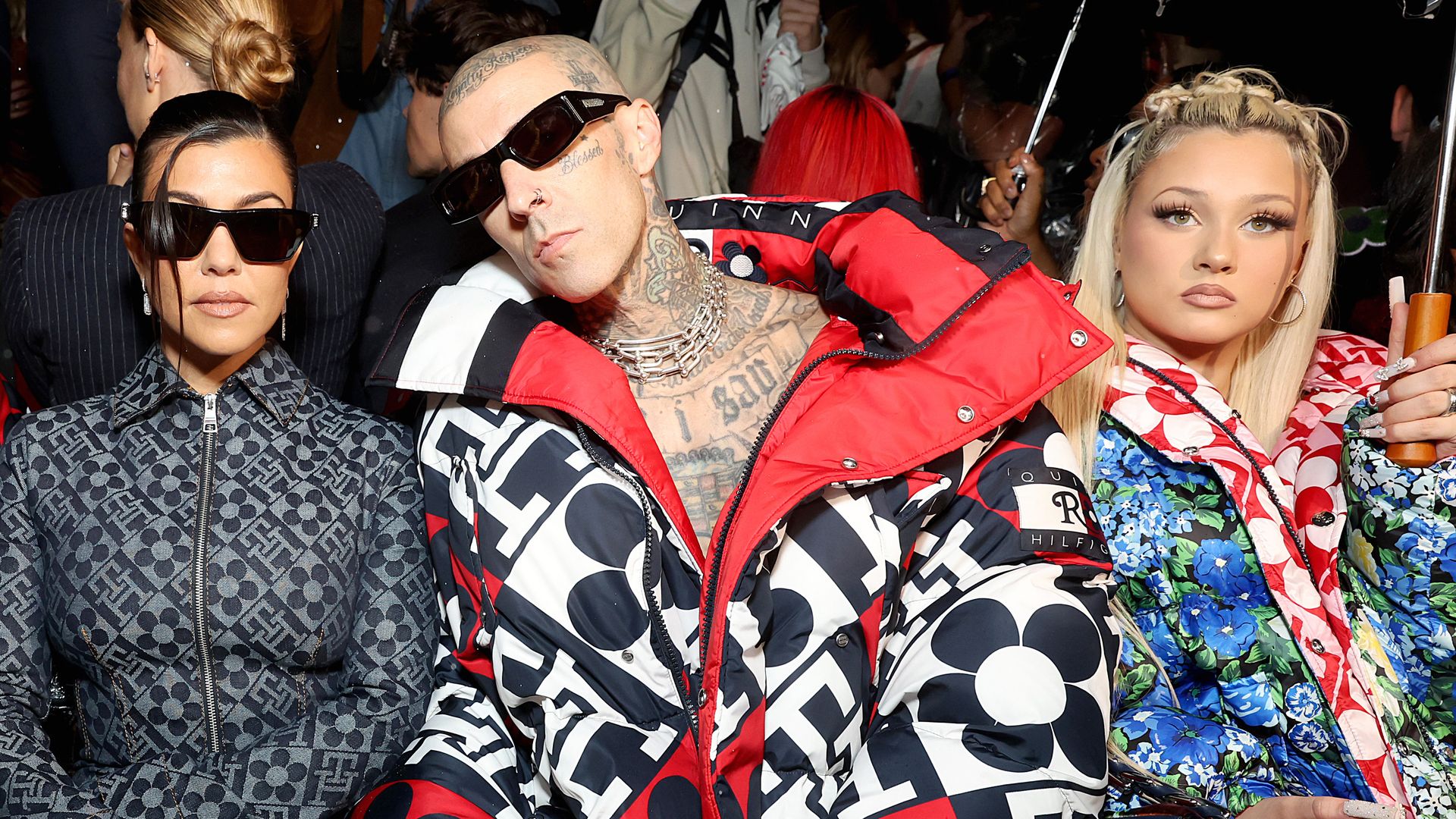 BROOKLYN, NEW YORK - SEPTEMBER 11: (L-R) Kourtney Kardashian, Travis Barker, and Alabama Barker attend Tommy Factory New York Fall 2022 at Skyline Drive-In on September 11, 2022 in Brooklyn, New York. (Photo by Monica Schipper/Getty I mages for Tommy Hilfiger)