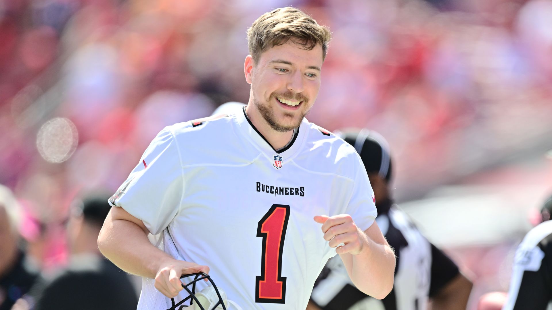 Youtube personality MrBeast runs on to the field prior to a game between the Tampa Bay Buccaneers and the Atlanta Falcons at Raymond James Stadium on 