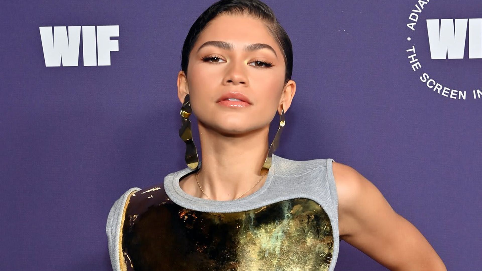 Zendaya looks gorgeous in gold breastplate dress at the 2021 Women in Film Awards