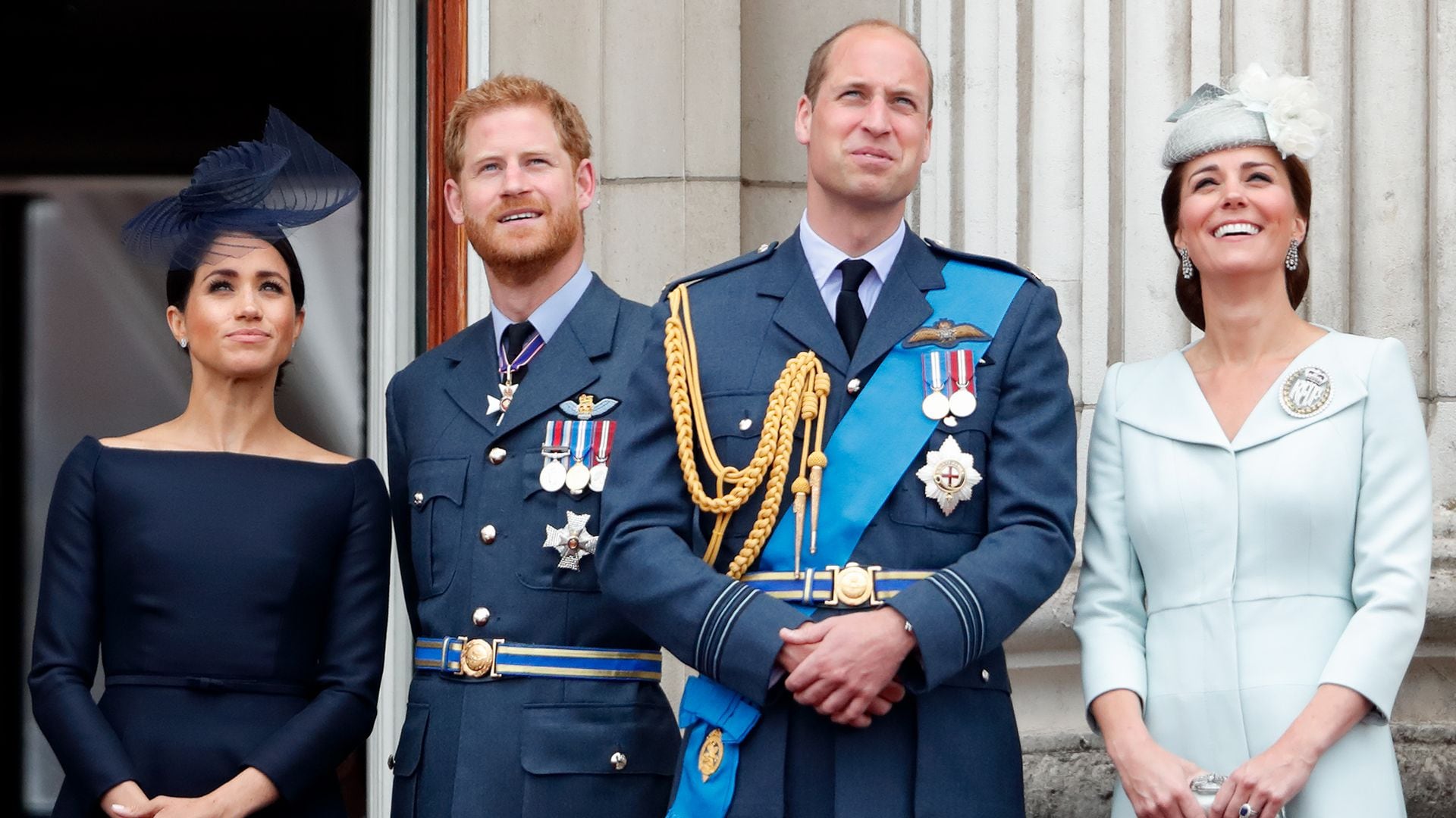 Meghan, Duchess of Sussex, Prince Harry, Duke of Sussex, Prince William, Duke of Cambridge and Catherine, Duchess of Cambridge watch a flypast to mark the centenary of the Royal Air Force from the balcony of Buckingham Palace on July 10, 2018
