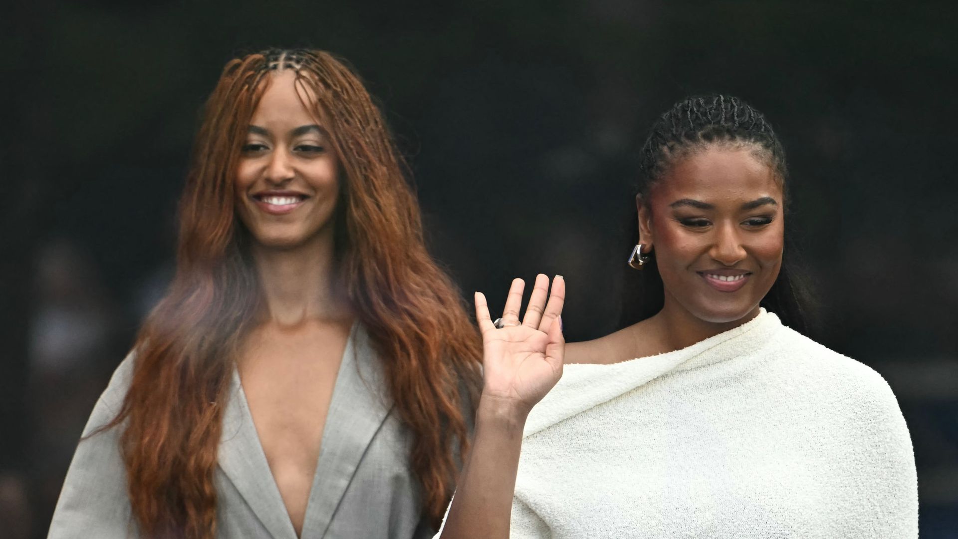 Malia (L) and Sasha Obama, daughters of former US president Barack Obama and his wife Michelle Obama, arrive at the opening of the Barack Obama Presidential Center in Chicago, Illinois, on June 18, 2026. (Photo by Kent NISHIMURA / AFP via Getty Images)