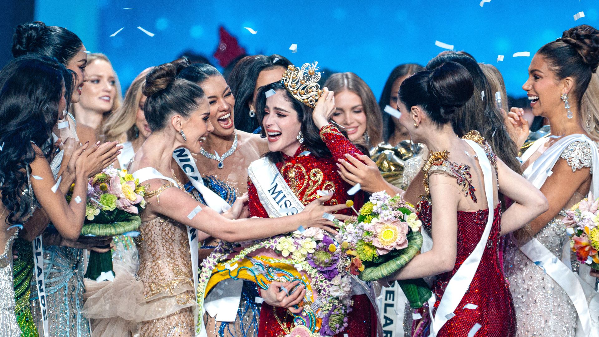 Fatima Bosch Fernández of Mexico (center) is celebrated after winning the title of Miss Universe 2025 (74th edition) at the final competition held at IMPACT Challenger Hall 2 in Nonthaburi, Thailand. The new queen from Mexico claimed the crown, while the representative of the host country, Veena Praveenar Singh from Thailand, achieved the remarkable position of 1st Runner-Up. The Miss Universe 2025 (74th edition) pageant showcased a massive field of talent, with a total of 120 beautiful contestants from around the world participating in the competition. (Photo by Arnun Chonmahatrakool/Thai News Pix/LightRocket via Getty Images)