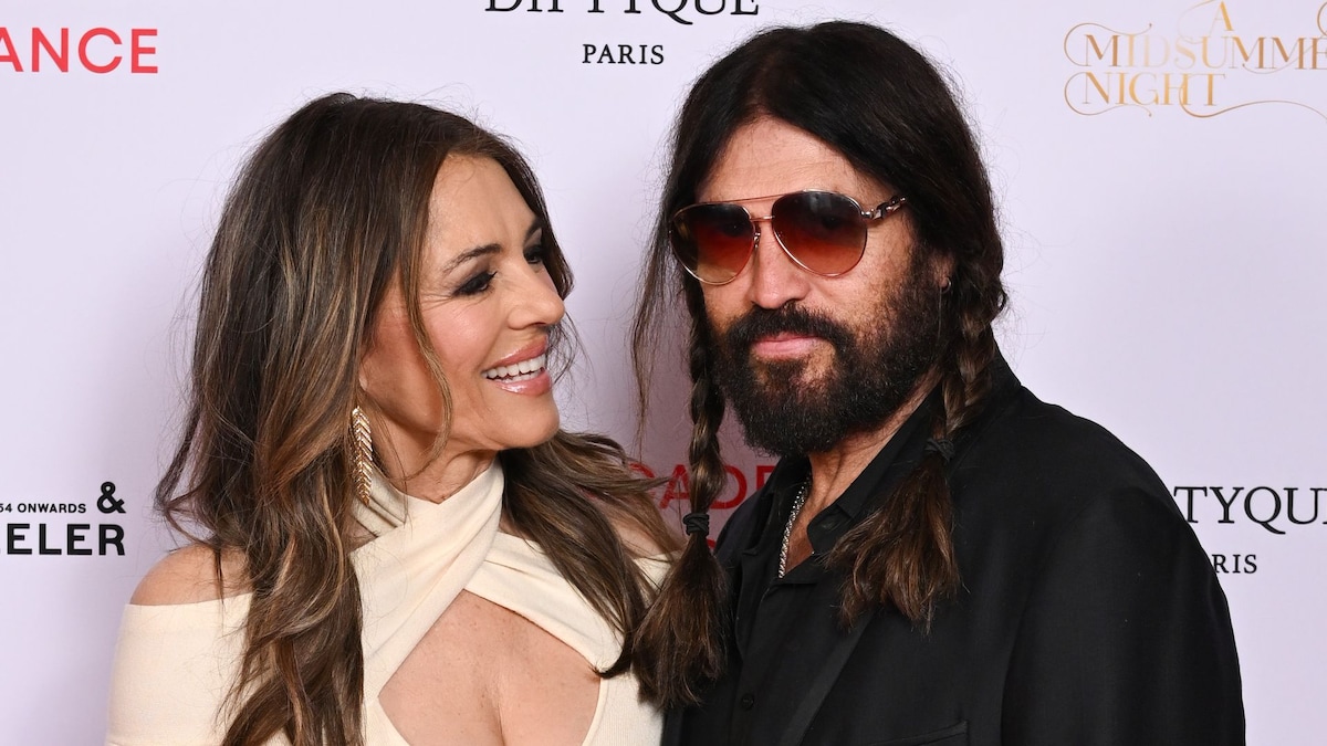 https://www.hola.com/us/horizon/landscape/b952260ad393-london-england-elizabeth-hurley-and-billy-ray-cyrus-attend-the-royal-academy-of-.jpg?im=Resize=(1200)