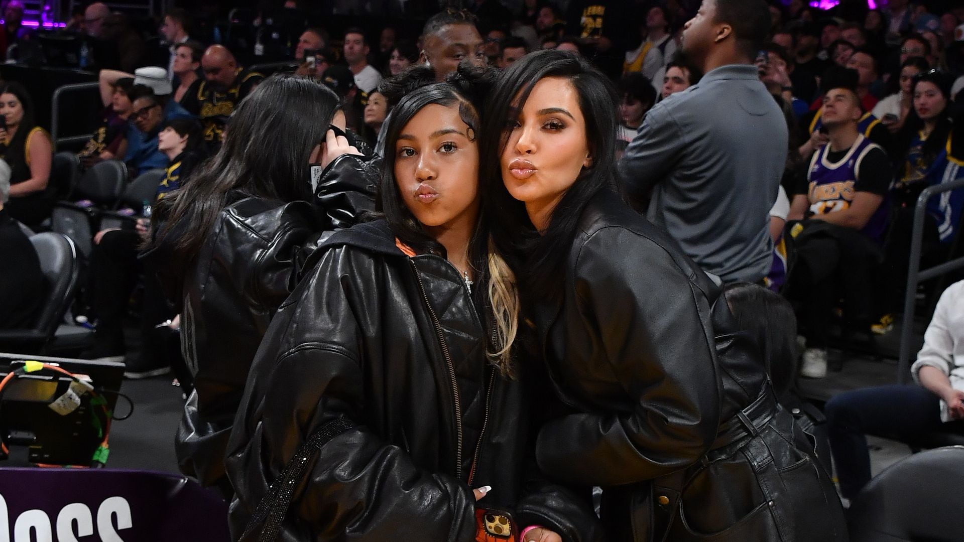North West surprises followers with face tattoos, contact lenses, and bold braids