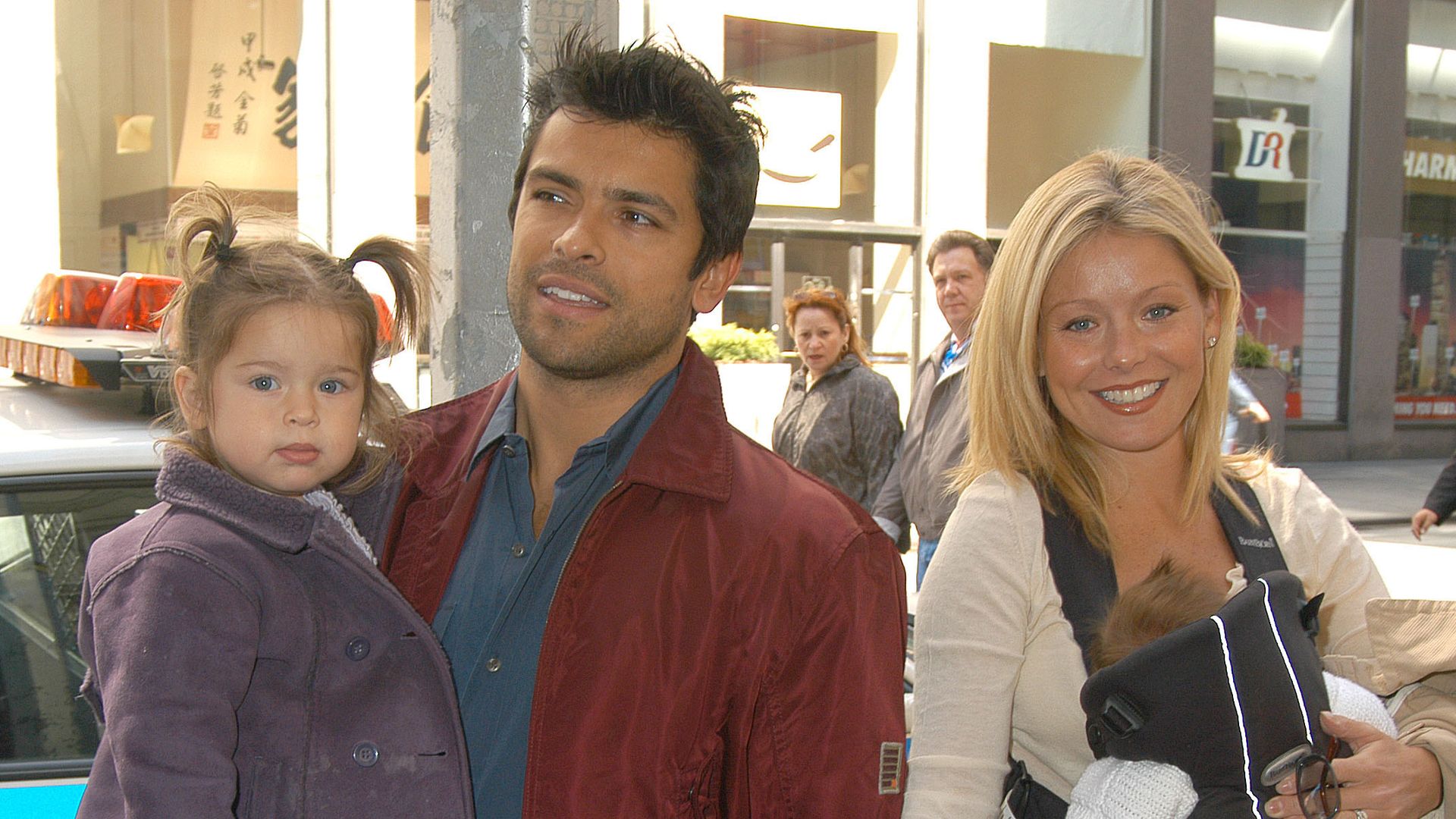 Kelly Ripa & husband Mark Consuelos & children Michael, Lola & Joaquin in kelly's arms (Photo by Robin Platzer/FilmMagic)