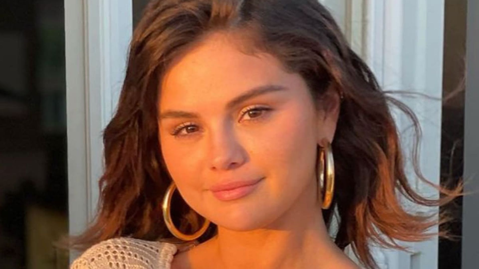 Selena Gomez pairs pink bikini with denim overalls for the perfect summer outfit
