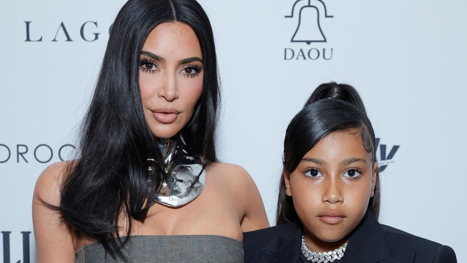 Kim Kardashian and North West match in leather at the Lakers game
