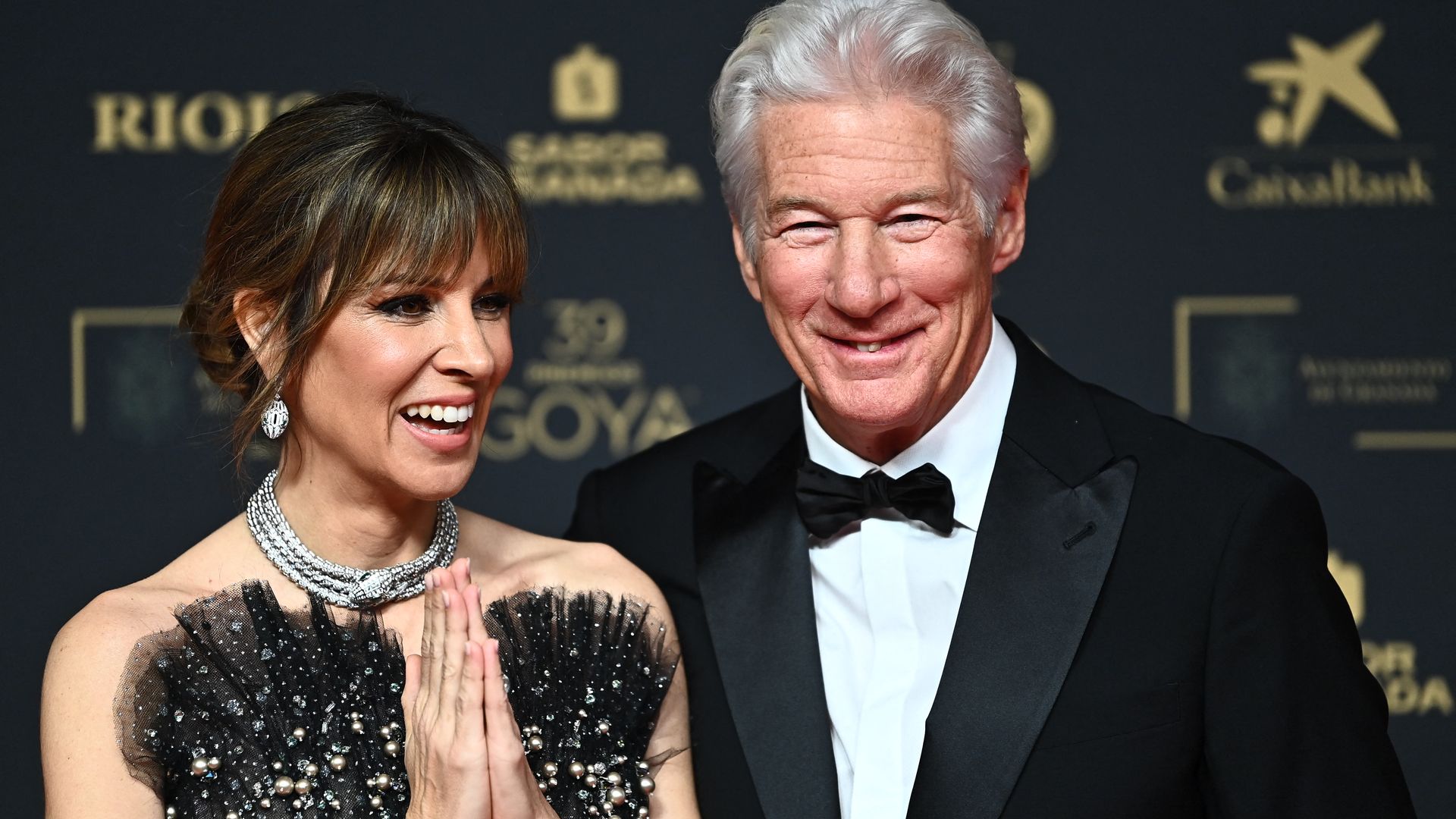 Richard Gere and his Spanish wife Alejandra Silva pose on the red carpet upon arrival prior the 39th Goya awards