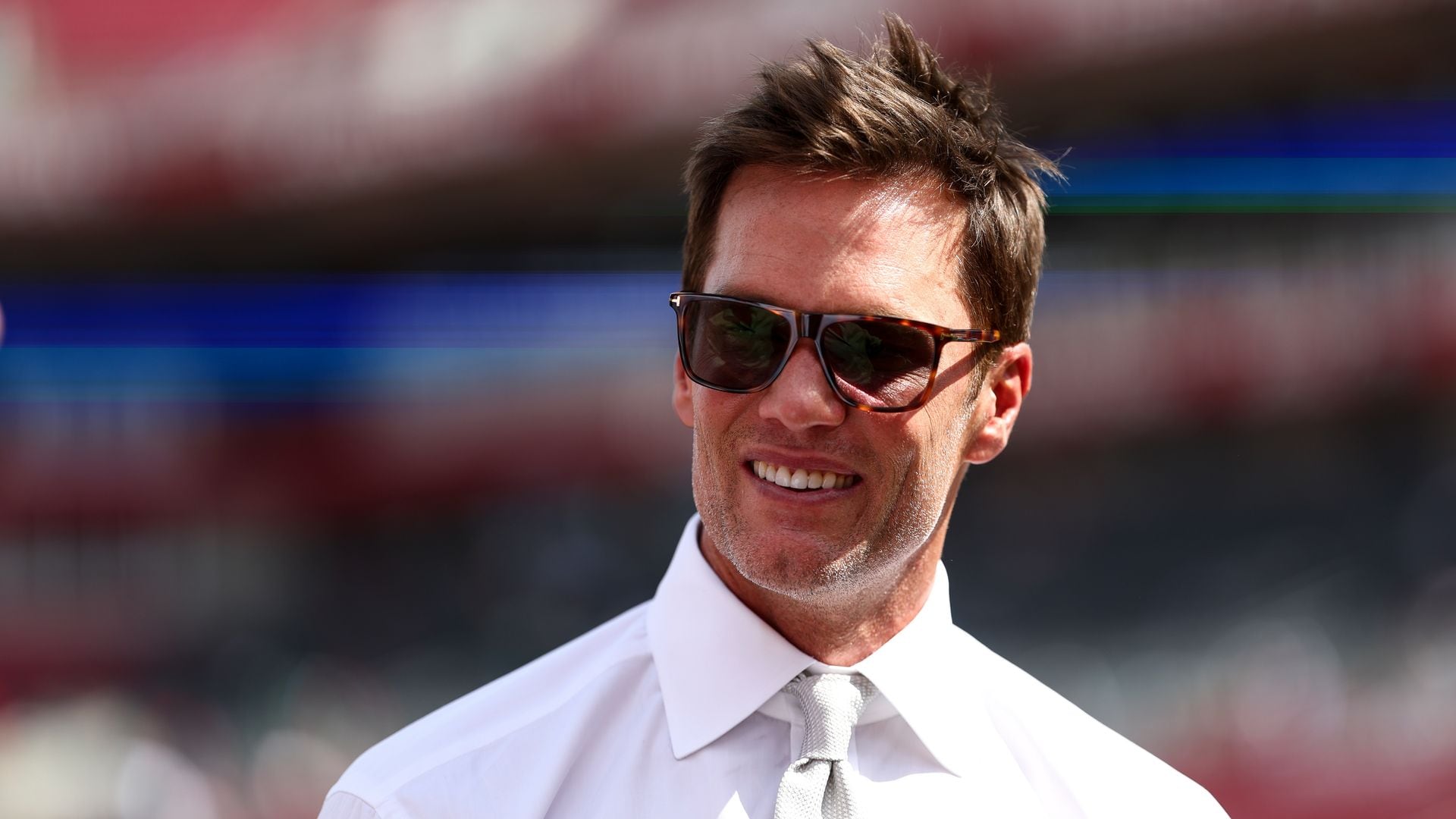  Fox Sports commentator and former NFL quarterback Tom Brady smiles prior to an NFL football game between the Tampa Bay Buccaneers and the Philadelphia Eagles at Raymond James Stadium on September 28, 2025 in Tampa, Florida. (Photo by Kevin Sabitus/Getty Images)