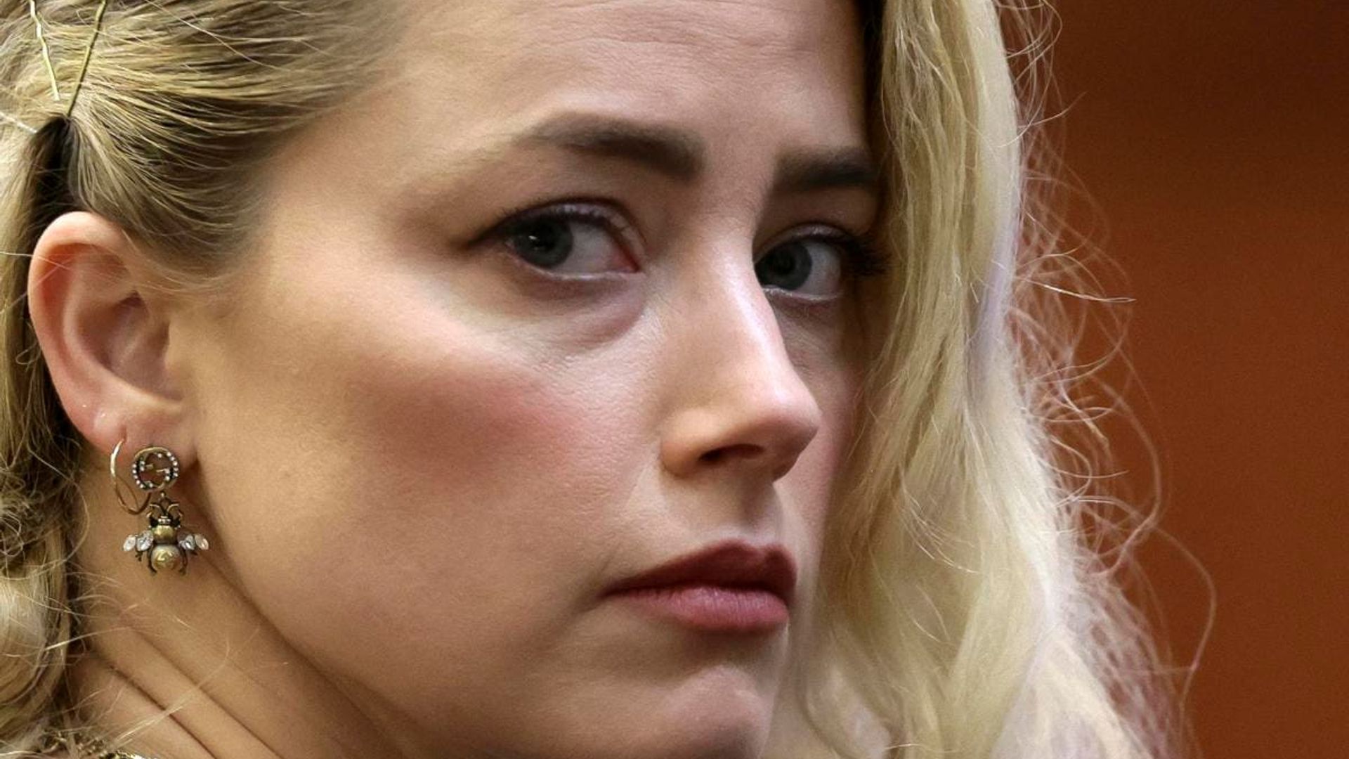 What would happen to Amber Heard if she fails to pay $10.35 million in damages to Johnny Depp