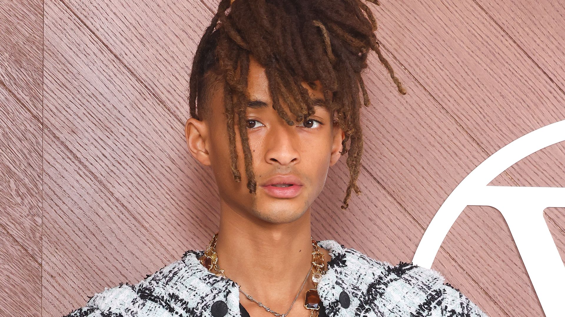 Jaden Smith turns heads in tweed jacket with dramatic sleeves and cinched waist at Paris Fashion Week