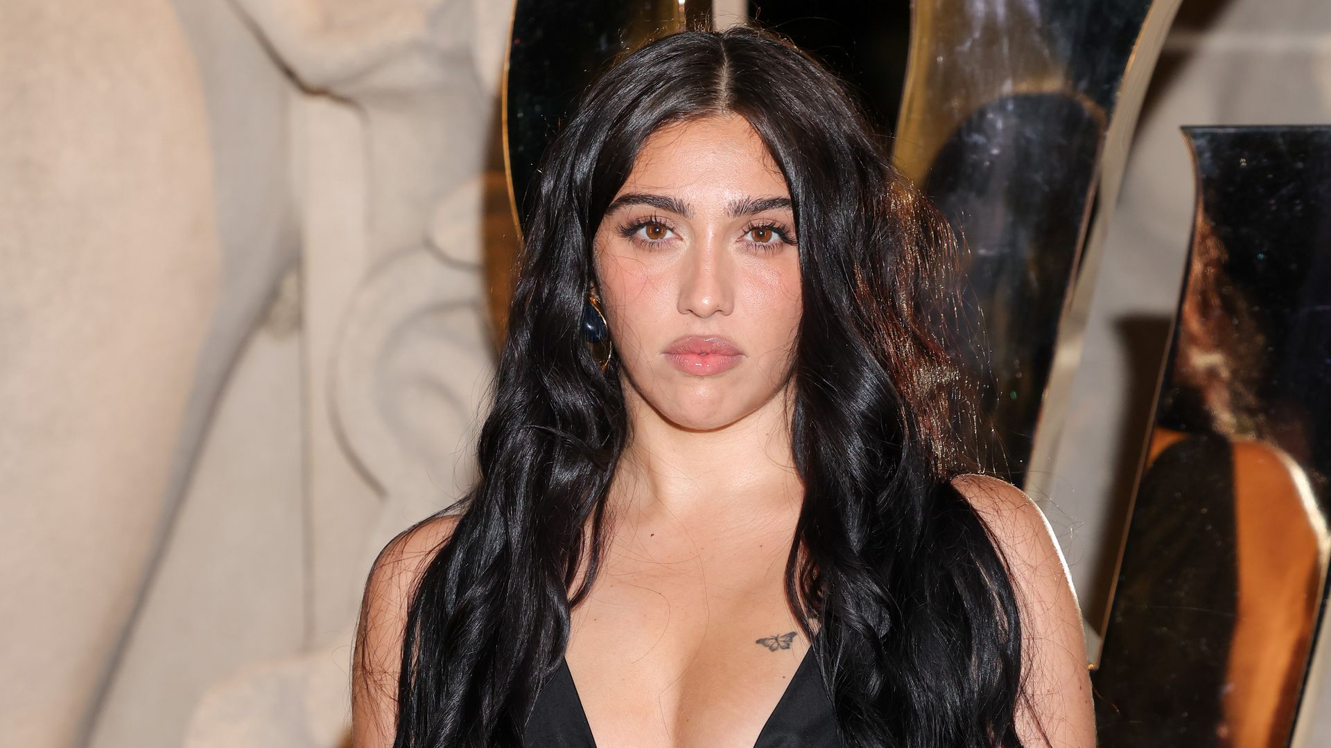 Lourdes Leon pairs black crop top with chic shoulder bag during frozen yogurt outing in New York