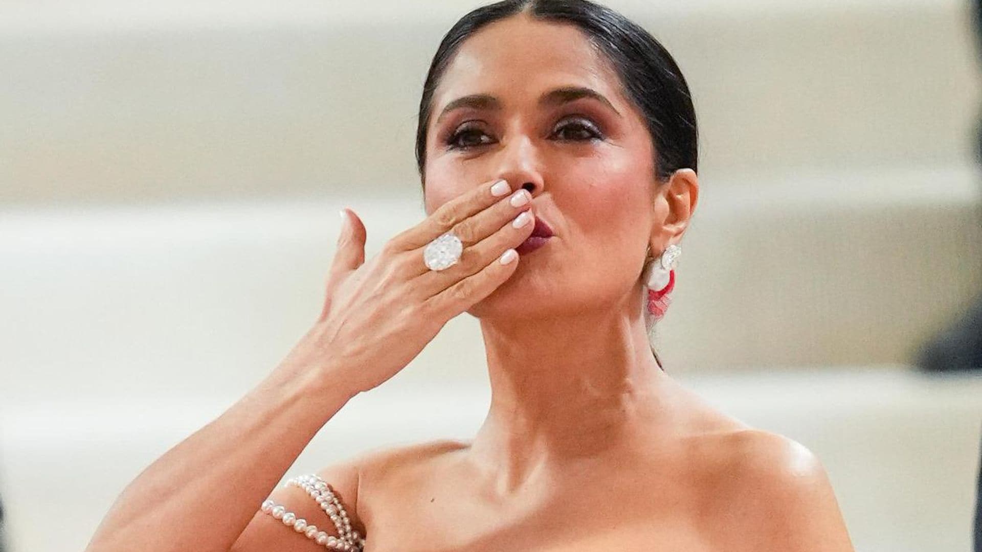 Salma Hayek takes a sizzling coffee break in a plunging swimsuit