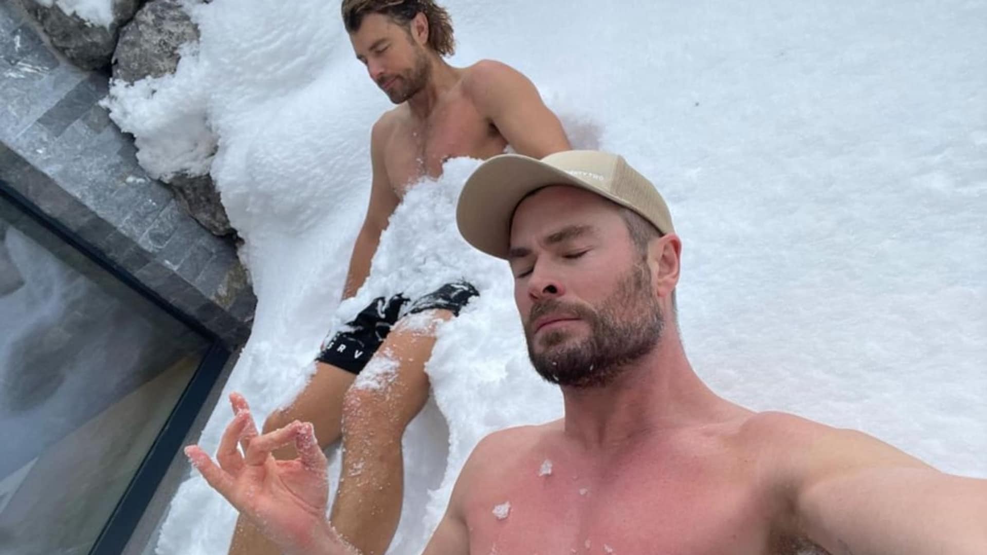 Chris Hemsworth ditches ice baths for a shirtless 'snow bath' to soothe his muscles