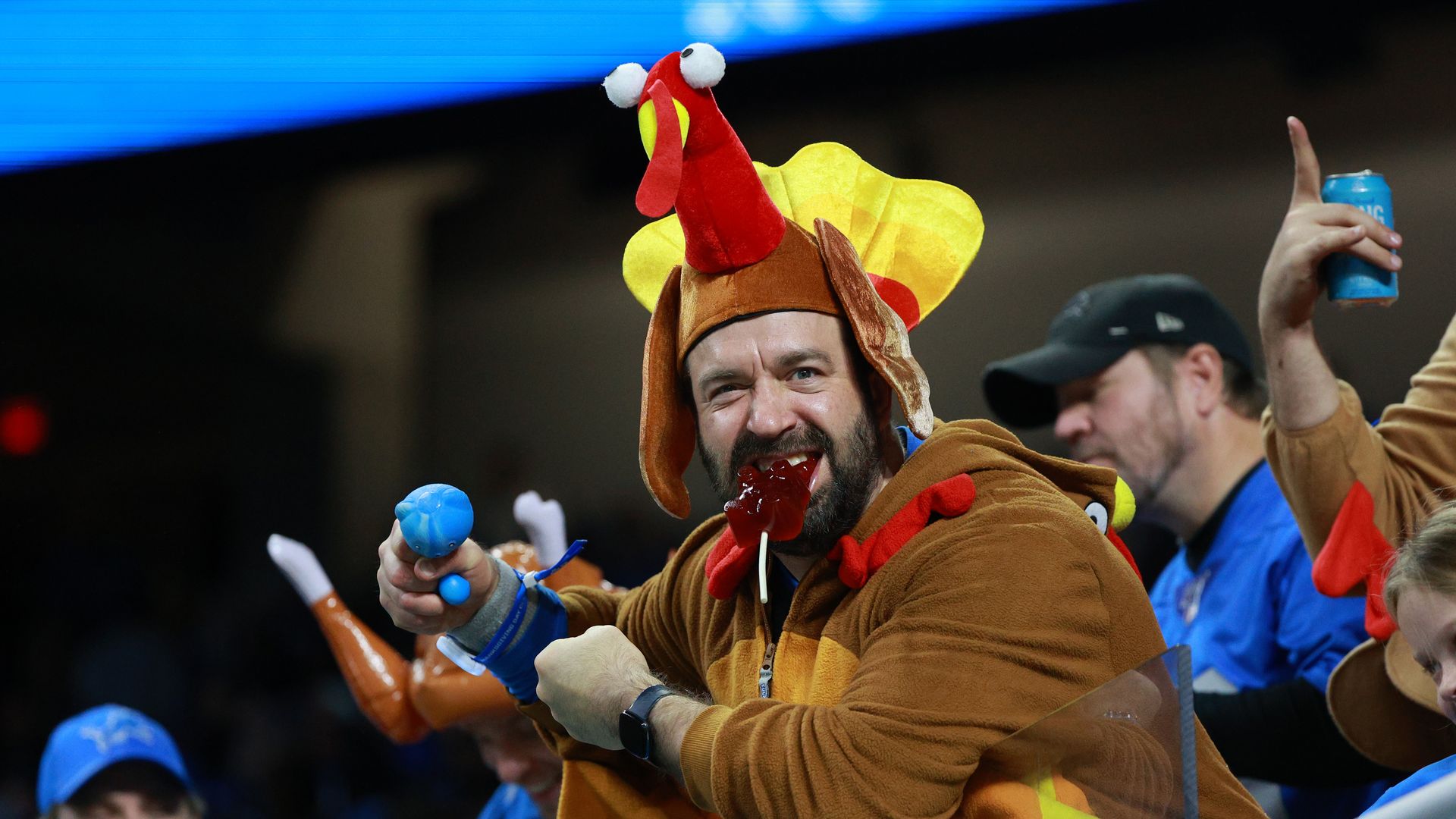 Detroit Lions fan cheers during the second half of an NFL Thanksgiving Day football game between the Chicago Bears and the Detroit Lions.