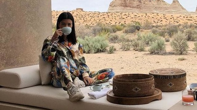Kourtney Kardashian drinking a hot beverage