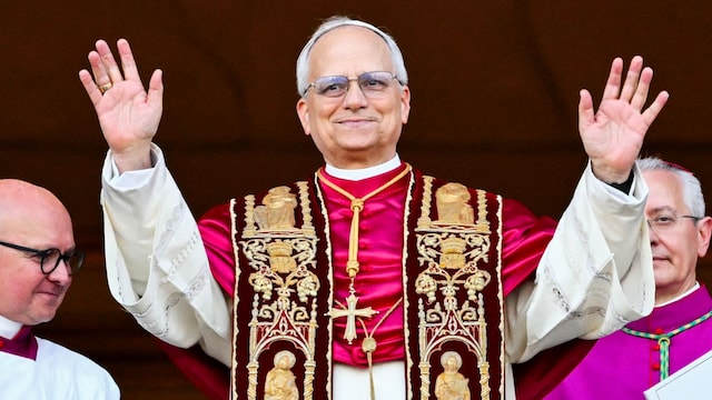Newly elected Pope Leo XIV, Robert Prevost arrives on the main central loggia balcony of the St Peter's Basilica for the first time.