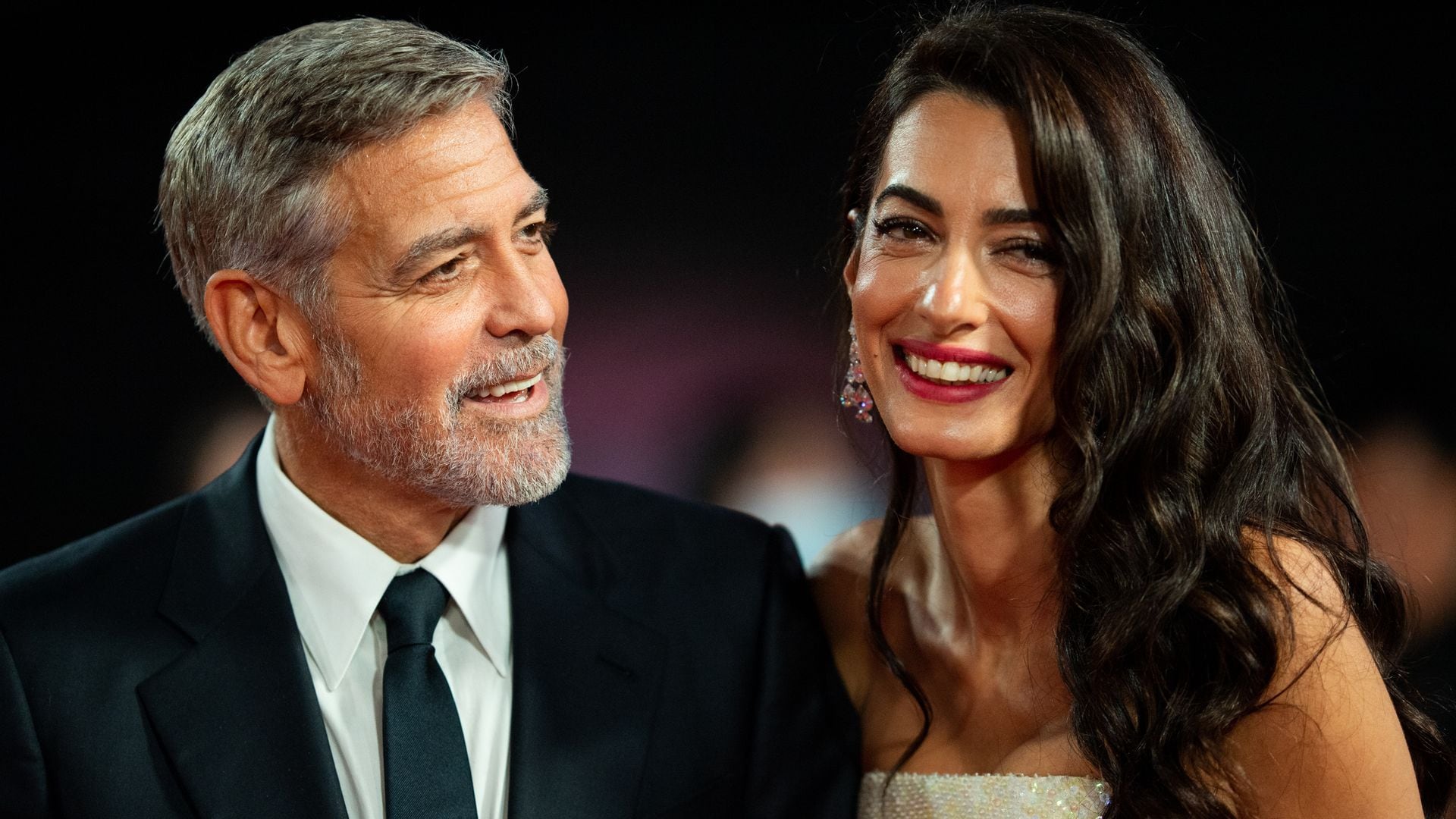 George and Amal Clooney hold hands for date in St. Tropez