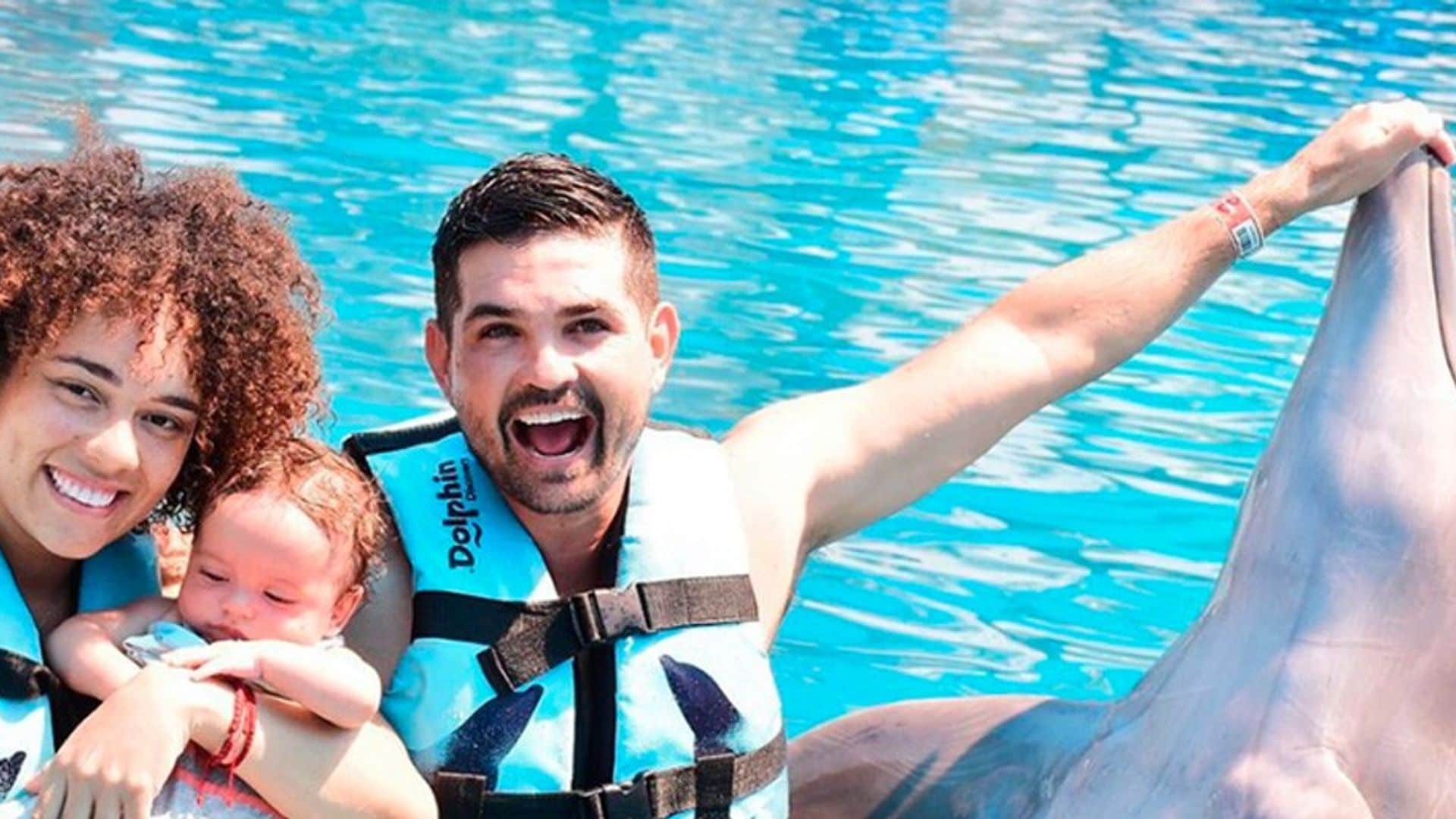 Ferdinando Valencia and Brenda Kellerman take son Tadeo to swim with dolphins