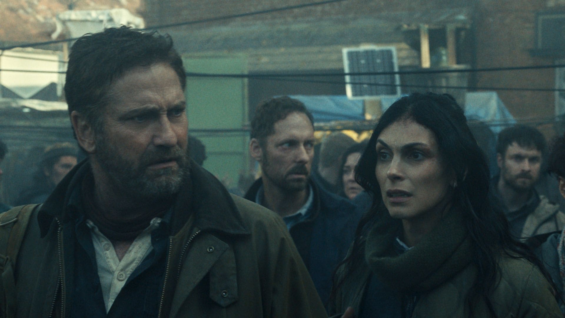 Gerard Butler as John Garrity, Morena BaccarinÂ as Allison Garrity, Amber Rose Revah as Dr. Casey Amina, and Roman Griffin DavisÂ as Nathan Garrity in Greenland 2: Migration. Photo Credit: Courtesy of Lionsgate 