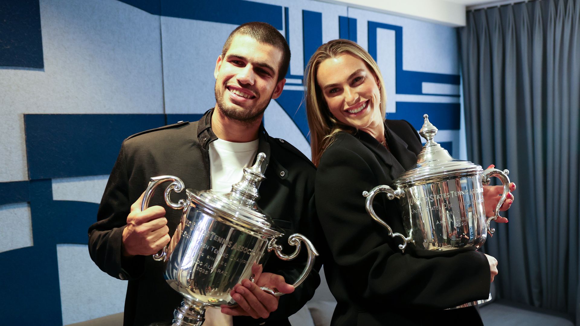 US Open 2025 Champions Carlos Alcaraz of Spain and Aryna Sabalenka make a Tik Tok during their appearance on the Today Show following following their victories in the Men's and Women's Singles finals at Rockefeller Plaza on September 08, 2025 in New York City. (Photo by Clive Brunskill/Getty Images)
