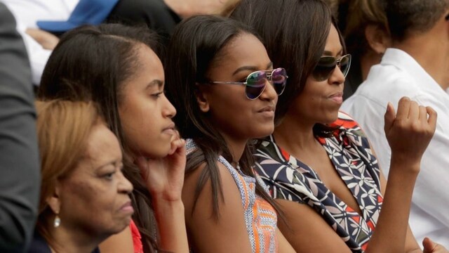 <b>4. She's her daughters' style inspiration</b>
While Michelle told <I>Essence</I>, "I tend not to worry about the trends, because what works for an 18-year-old selfie queen may not for a 52-year-old First Lady who is a mom of teenagers", she and her daughters have been known to rock similar styles. During a trip to Cuba, seen here, Michelle and Sasha wore identical pairs of aviator sun shades.
Photo: Getty Images