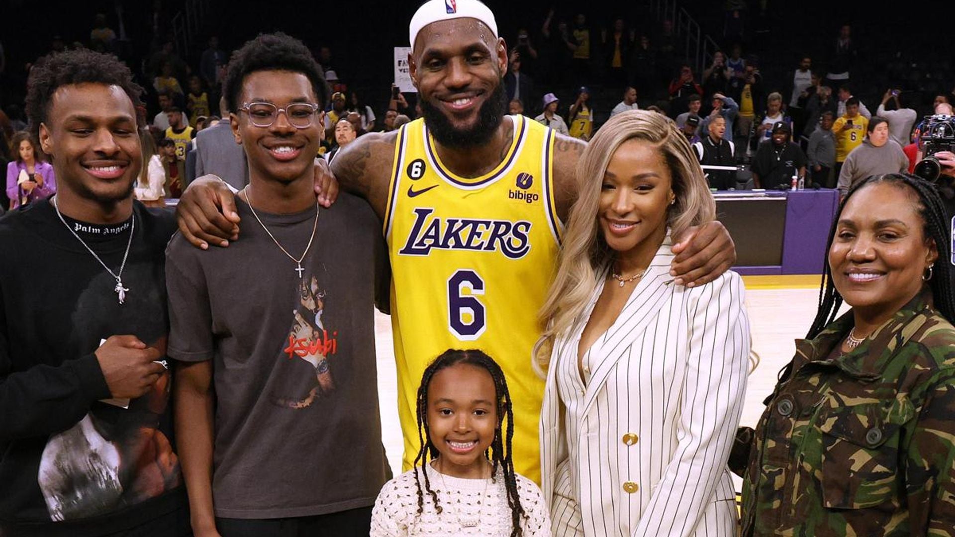 Lebron James celebrates with his wife and kids as he breaks NBA record