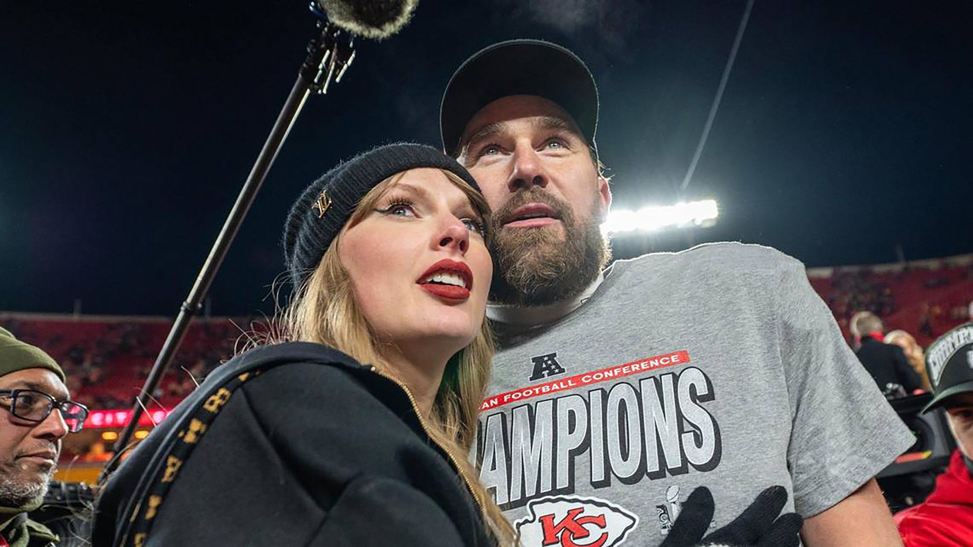 Taylor Swift, left, and Kansas City Chiefs tight end Travis Kelce walk off the field after the trophy ceremony following the Chiefs' 32-29 victory over the Buffalo Bills in the AFC Championship Game on Jan. 26, 2025, at GEHA Field at Arrowhead Stadium in Kansas City, Missouri. (Emily Curiel/Kansas City Star/Tribune News Service via Getty Images) 