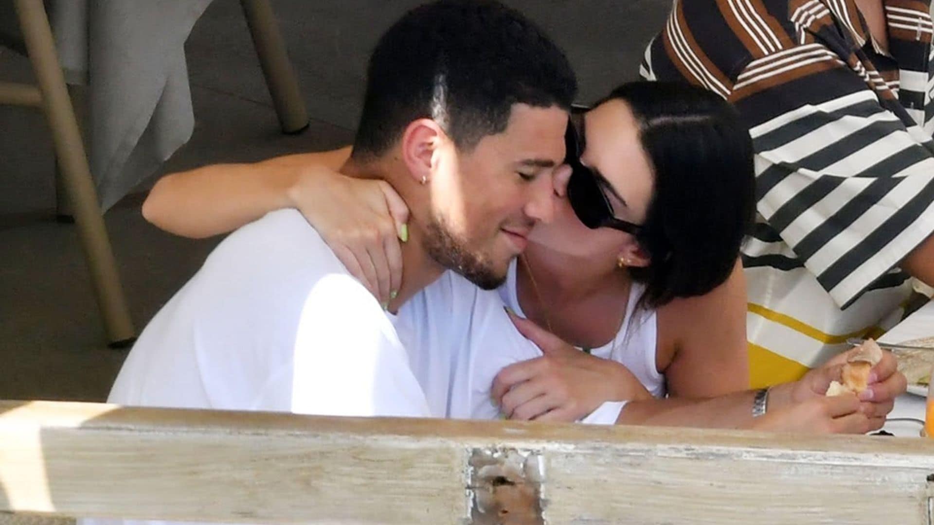 Kendall Jenner wasn’t shy about kissing Devin Booker at lunch in Italy
