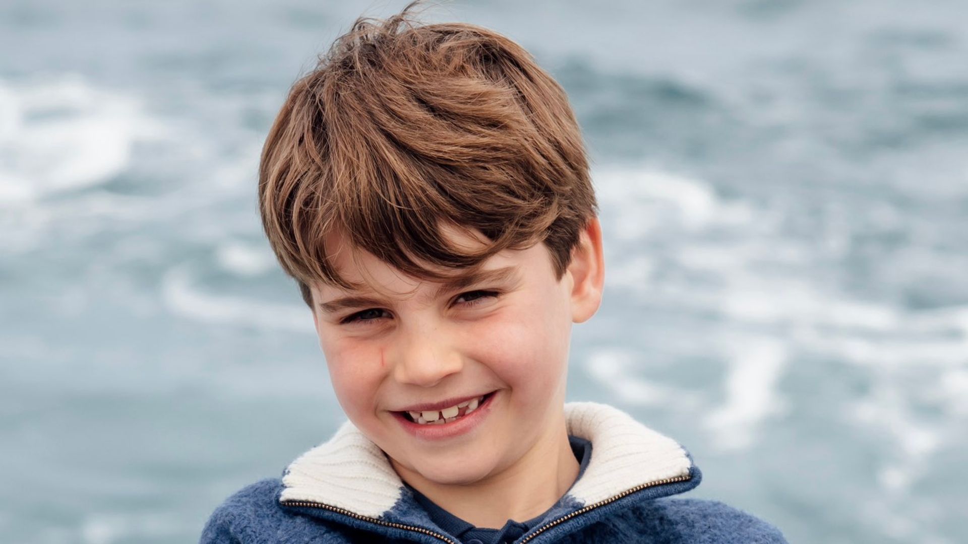 Prince Louis dives into his eighth year with a wetsuit and a winning smile