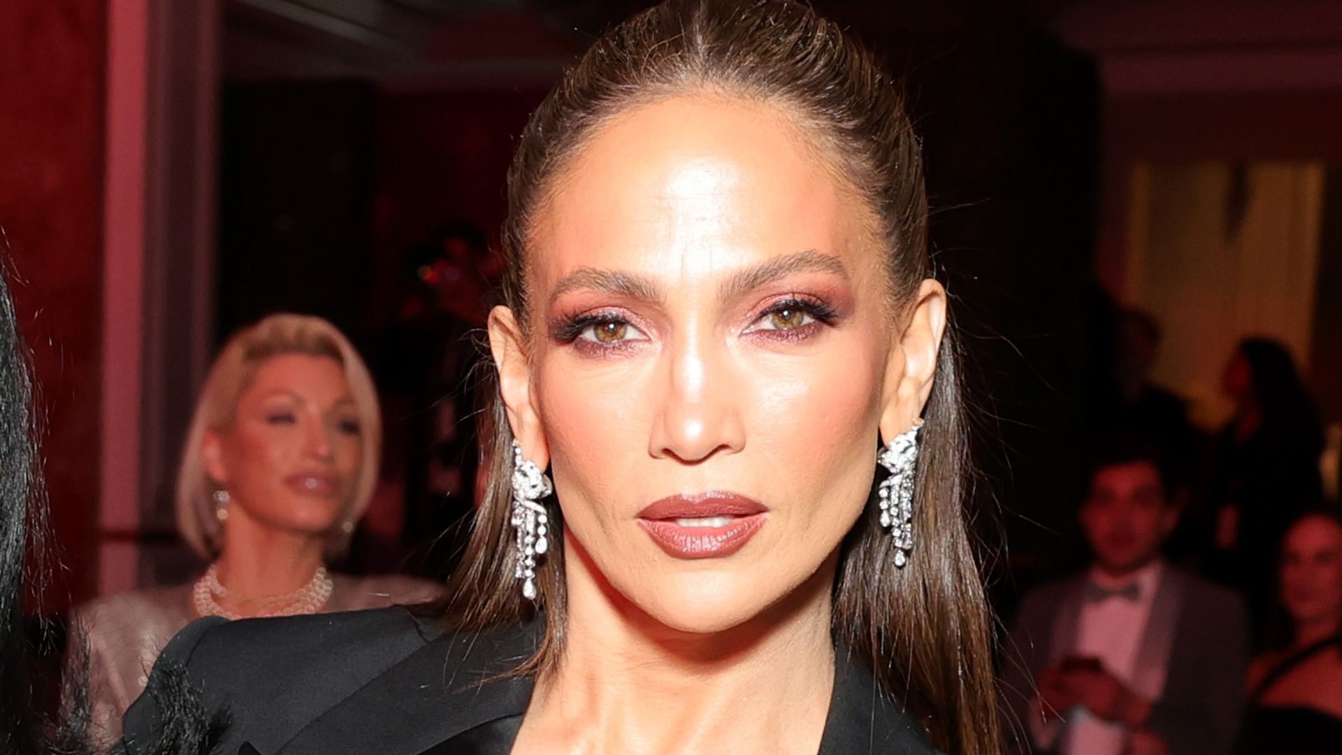 Jennifer Lopez pairs silky slip dress with lace-trim neckline and tuxedo-inspired blazer at Beverly Hills gala