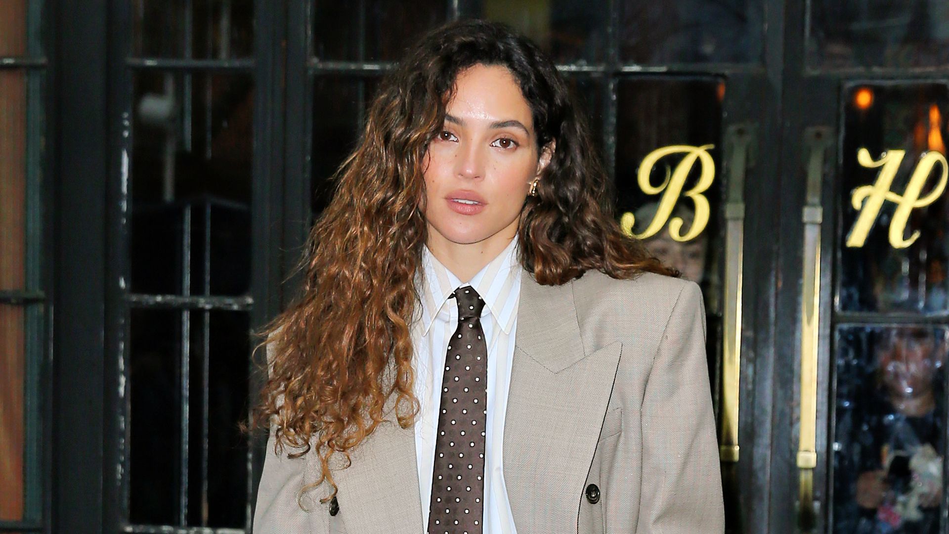 Adria Arjona turns heads with sexy twist on oversized suit in latest NYC outing