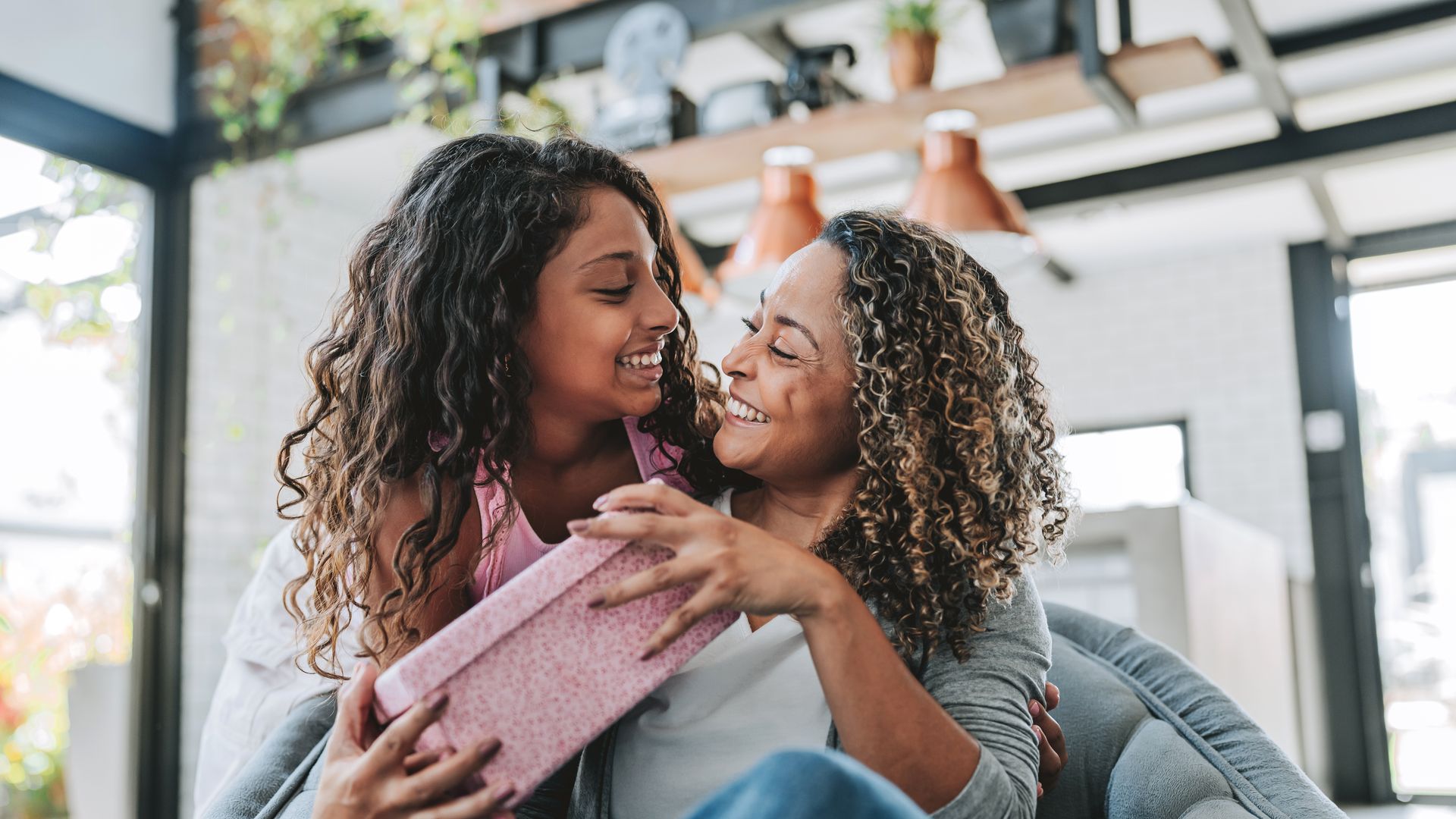 Daughter presents a gift to her mother