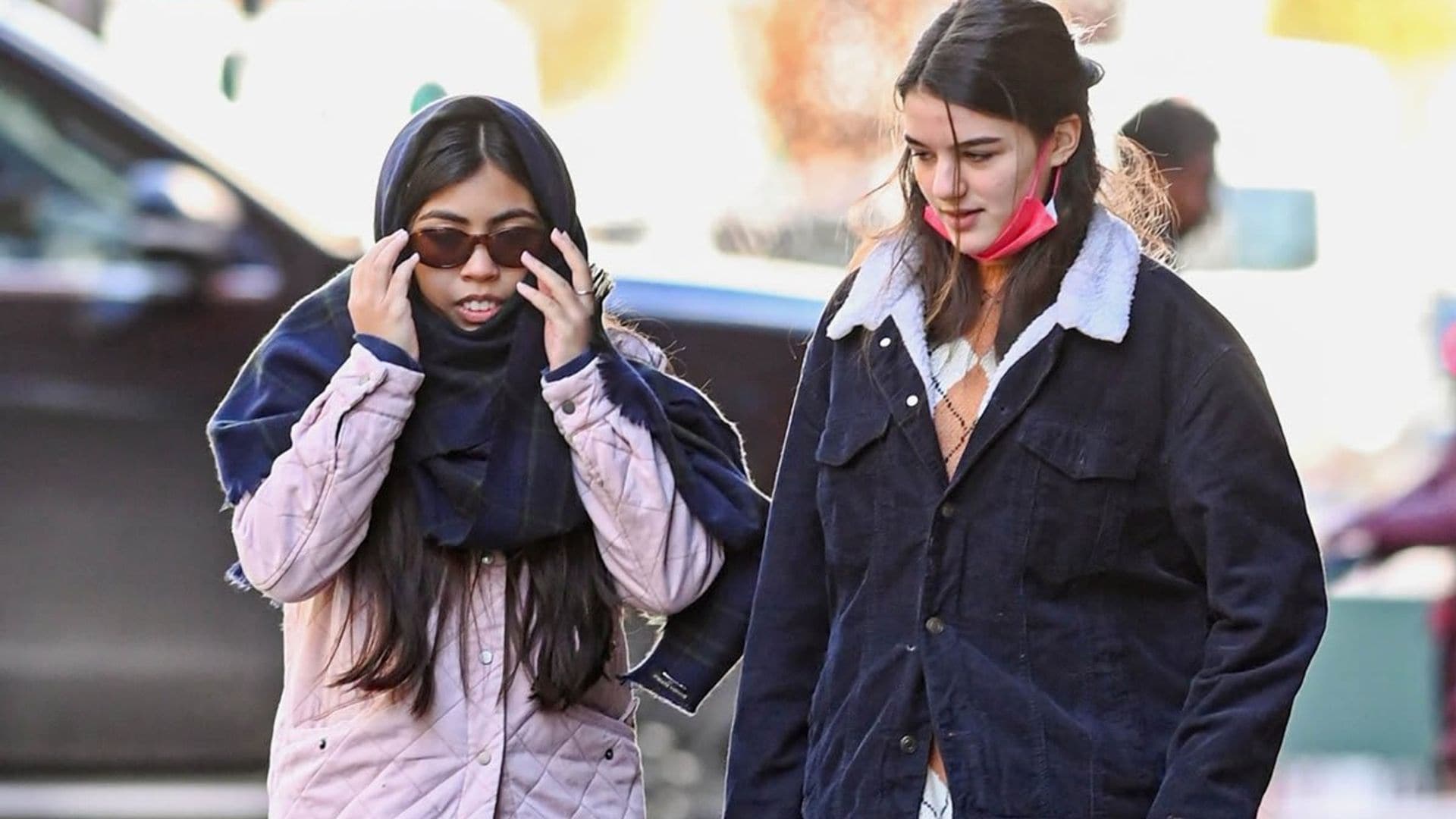Suri Cruise spends the day with a friend in chilly NYC