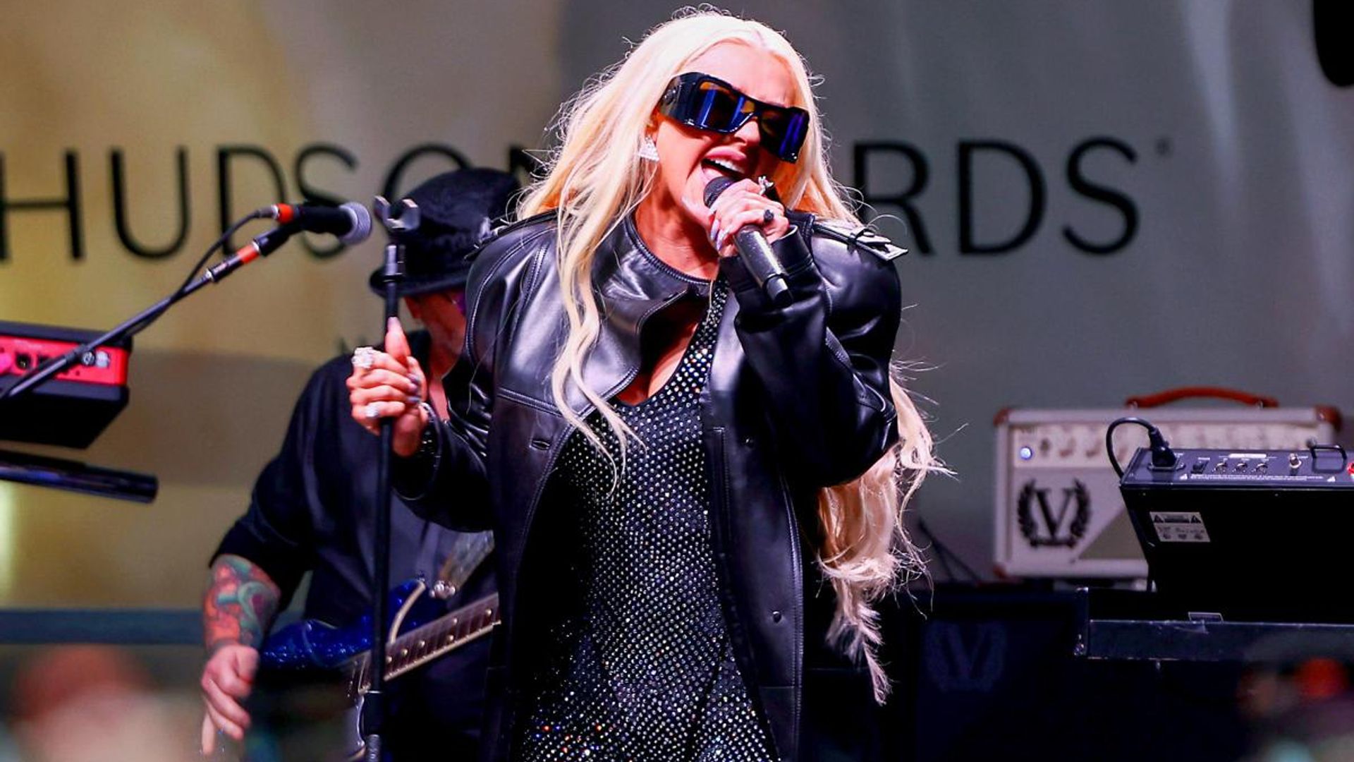 Christina Aguilera wears a rainbow glittery bodysuit at Pride concert