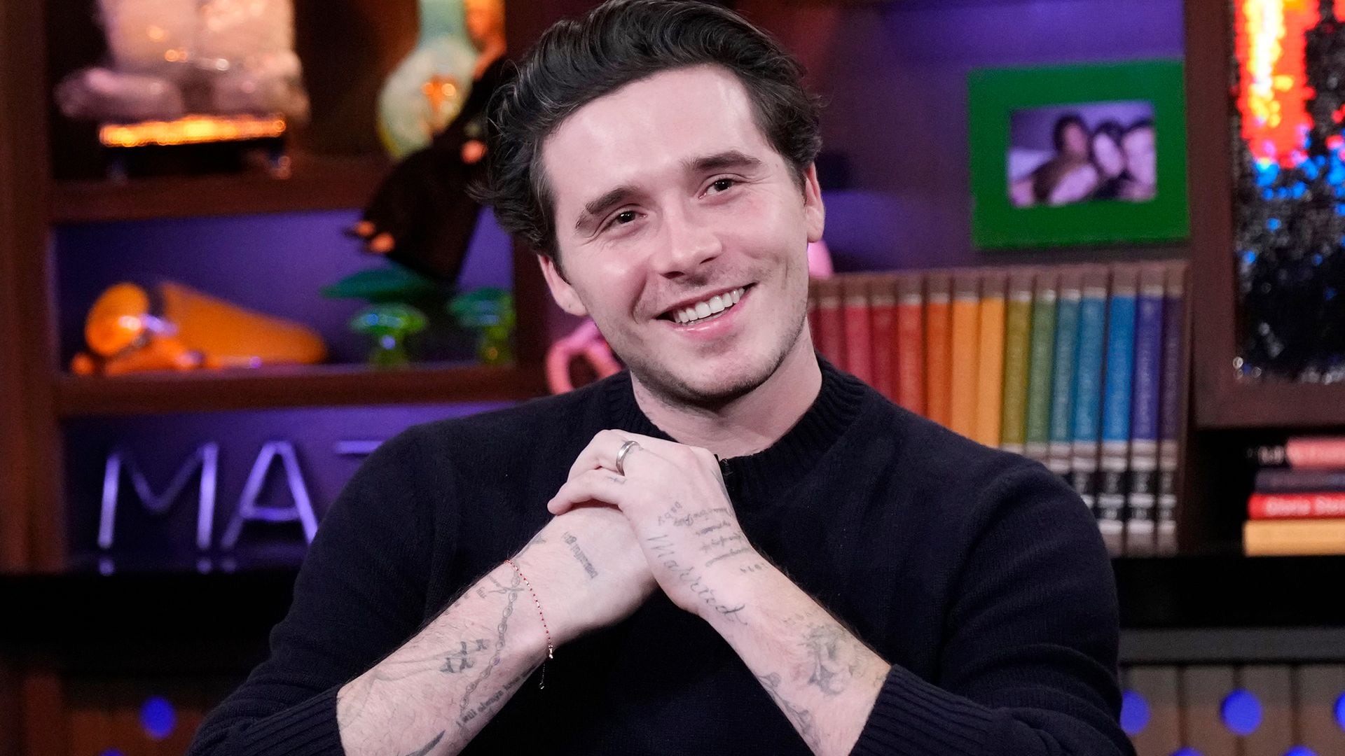 Brooklyn Beckham takes a spin on a vintage motorcycle as family drama escalates