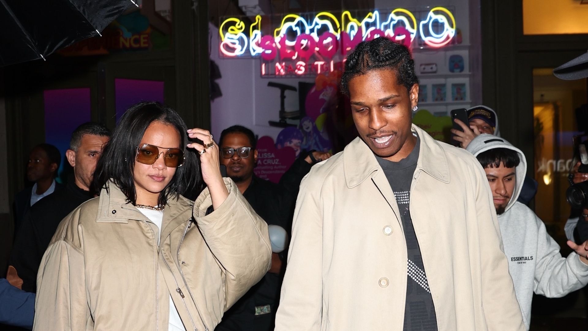 Rihanna wore a beige cropped jacket identified by fashion accounts as Miu Miu, oversized cream pants, and a vintage-style burgundy leather bag, while A Rocky wore a beige Burberry-style trench coat.