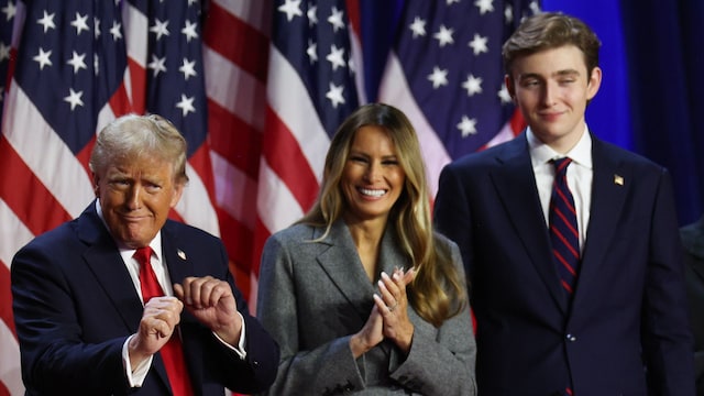 Donald Trump dances on stage with former first lady Melania Trump and Barron Trump during an election night event at the Palm Beach Convention Center on November 06, 2024 in West Palm Beach, Florida. Americans cast their ballots today in the presidential race between Republican nominee former President Donald Trump and Vice President Kamala Harris, as well as multiple state elections that will determine the balance of power in Congress.   (Photo by John Moore/Getty Images)