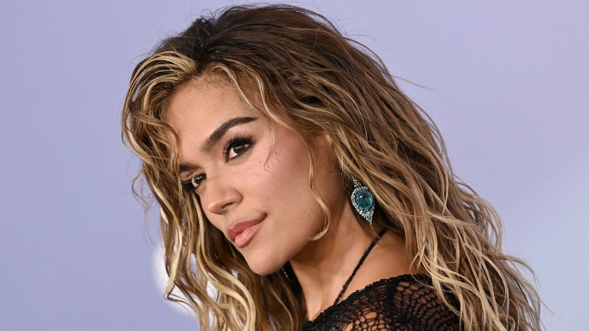 Karol G breaks down in tears after emotional message to fans during concert