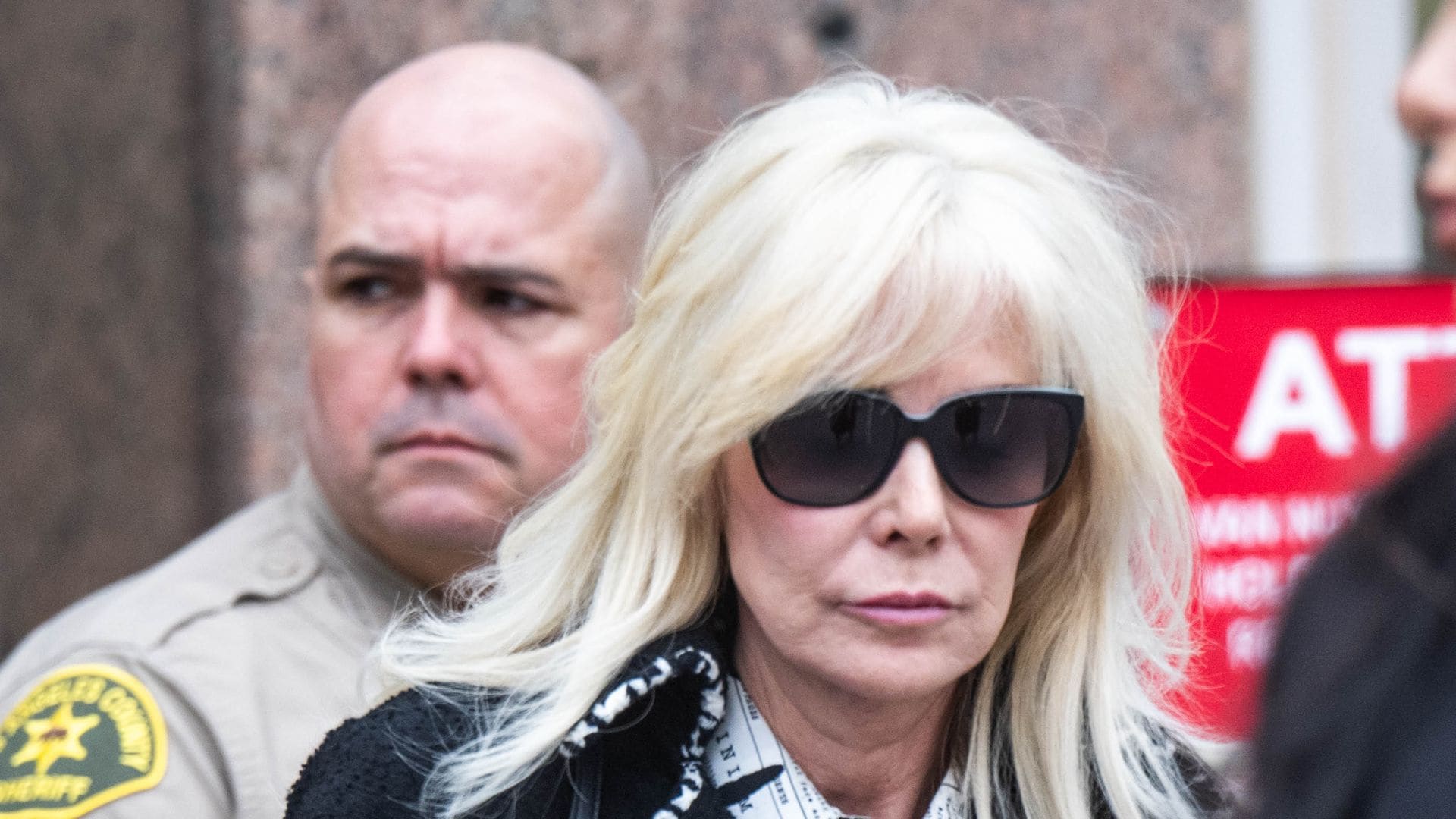 Tammi Menendez, Erik Menendez' wife, leaves the Van Nuys Courthouse after a hearing on Erik and Lyle Menendez case on Monday, November 25, 2024. The Menendez brothers were seeking to have their 1989 convictions reexamined in the shotgun murders of their parents in their Beverly Hills home. (==